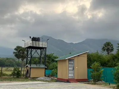 a small building with a lifeguard tower on top of it at Ibex Resorts, Malampuzha - Kava Eco Camp and Caravan Park in Palakkad