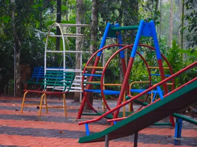 a group of colorful playground equipment in a park at Fogland Villa in Vaduvanchal