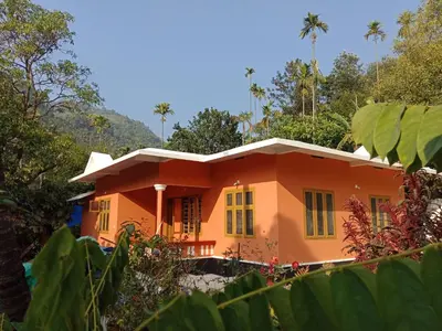 a house in the middle of a forest at Vanilla Farms in Koroth