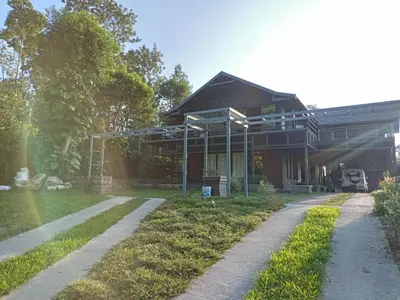 a house with a pathway in front of it at Ranches & Kennels 2BR Coorg in Kushālnagar