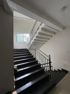 a spiral staircase in a building with a window at AC Arcade in Parli