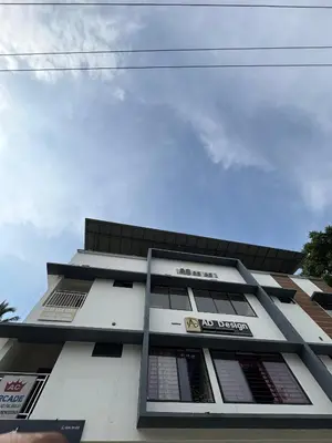 a building with many windows on the side of it at AC Arcade in Parli