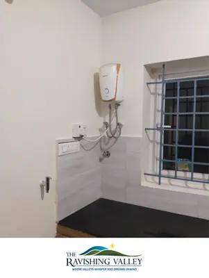 a room with a soap dispenser on the wall at Ravishing Valley in Ketti