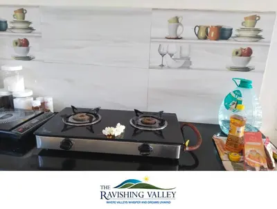 a stove top with two plates on top of it at Ravishing Valley in Ketti