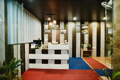 a lobby with a reception desk in a building at GVK Holiday Inn in Mysore