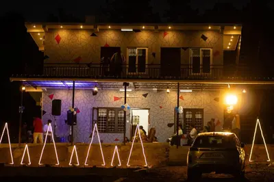 a house at night with a car parked in front at Casablanca Resort in Kanthalloor