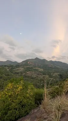a view of a valley with mountains in the distance at Casablanca Resort in Kanthalloor