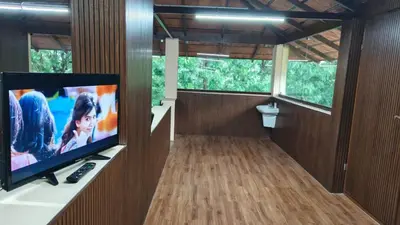 a room with a flat screen tv on a wall at Eagles Nest in Dimbam