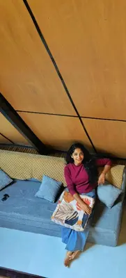 two girls sitting on a bunk bed in a tent at Cherry Blossoms Chalet in Kozhikode