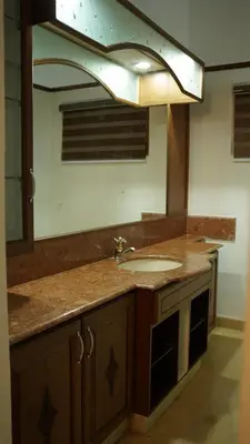 a bathroom with a sink and a mirror at Hotel Vintage Palace in Tattamangalam