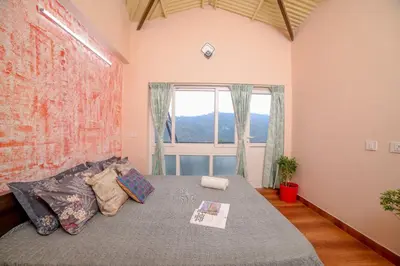 a bedroom with a bed with a large window at Spring Fields in Coimbatore