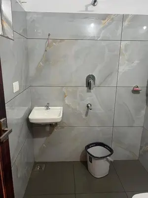 a bathroom with a sink and a toilet at Mynakam - A peaceful escape in Vythiri