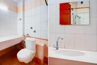 a bathroom with a toilet and a sink at Collection O Puthali Park Near Mysuru Railway Station in Mysore