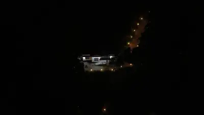 a house is lit up at night with lights at Oryx Villai in Vythiri