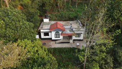 an aerial view of a house with a red roof at Oryx Villai in Vythiri
