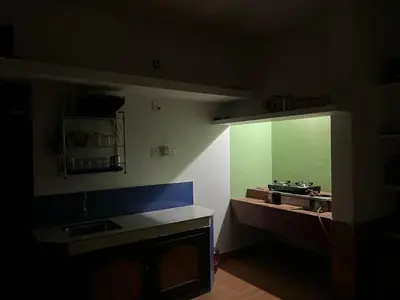 a kitchen with a sink and a mirror on the wall at Oryx Villai in Vythiri