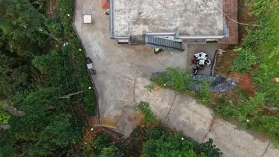 an overhead view of a person standing on a patio at Oryx Villai in Vythiri