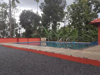 a swimming pool in the middle of a road at Empire Life Pool Villa in Meenangadi