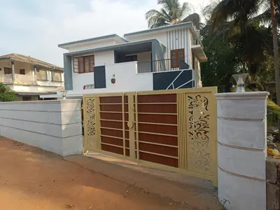 a house with a gate and a fence at La- casona in Kottayam