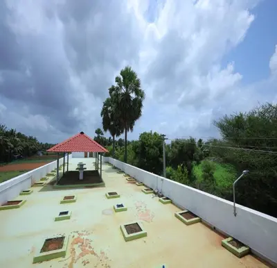 a view from the roof of a building with a pavilion at The Canalway Inn in Pollāchi