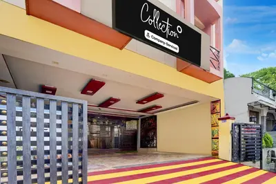 a building with a sign on the side of it at Super Collection O Omni Bus Terminal Gandhipuram Formerly Apple Grand in Coimbatore