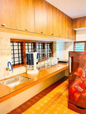 a kitchen with a sink and a counter top at Joevilla-1BHK Near Kottiyoor in Kelakam