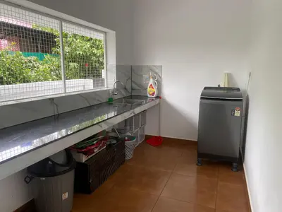 a kitchen with a counter and a window and a heater at Wayanad Mona Villa in Wayanad