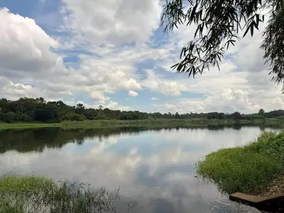 a view of a river with a cloudy sky at Do not book in Kāladi