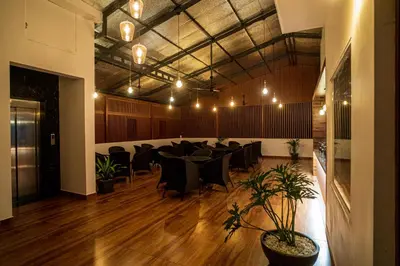 a conference room with a table and chairs in it at DQ Premium Apartments in Ernakulam