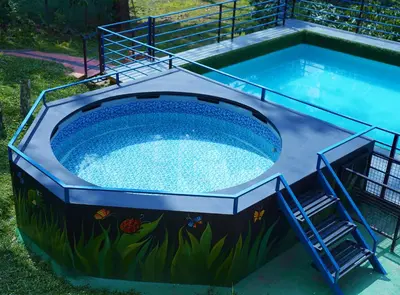 a swimming pool with a painting on the side at Wayanad Coffee Vintage in Wayanad