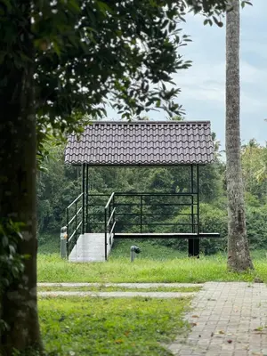 a gazebo in the middle of a park at Kerala Heritage Private Pool Villa - Tharavad in Māla