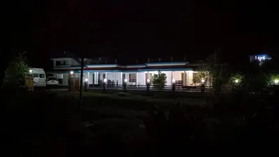 a house lit up at night with lights at Jewel Homes Thattekad For birding and families - An ISO9001 ISO14001 ISO22000 Certified in Thattakād