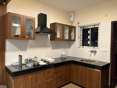 a kitchen with a counter top and a sink at Away From Home - 7 - Home Stay Ooty, Entire 3BHK Villa in Ooty