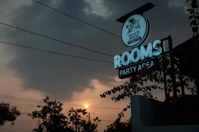 a neon sign for a roones party area at Beach House in Kozhikode