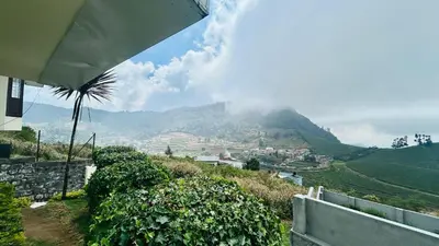 a view of a mountain from a house at Away From Home - 1 - Home Stay Ooty, Entire 3BHK Villa in Ooty