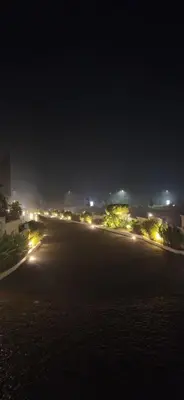 a view of a street at night with lights at 2BR Flat with Pool and Balcony near Cochin Airport in Cochin