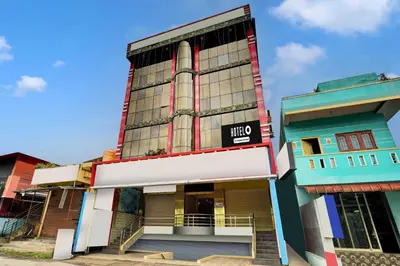 a building with a sign on the side of it at Hotel O Kushal Nagar Near KSRTC Bus Stand in Kushālnagar