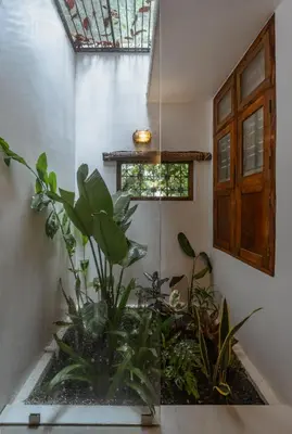 a room with a aquarium with plants in it at The Oneness Living- Seasonal Heritage stay with Tholpaavakoothu nights in Pazhayannūr