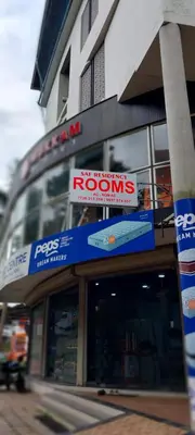 a store with a sign on the front of a building at SAF RESIDENCY mukkam in Mukkam