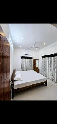 a bedroom with a large bed in a room at Mariya Stay in Kanjikode