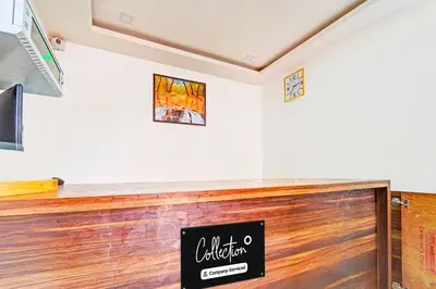 a restaurant counter with a sign on the wall at Collection O Ooty Government Rose Garden in Ooty