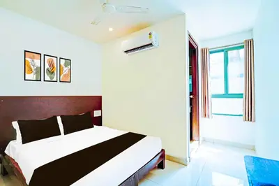 a bedroom with a large bed in a room at Collection O Teresian College Mysore in Mysore