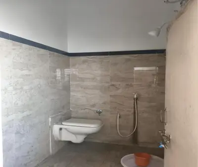 a bathroom with a toilet and a shower at Prm classic lodge in Erode