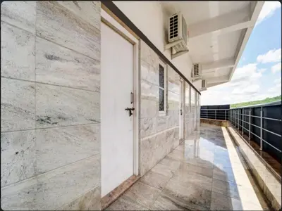 a hallway of a house with a door at Prm classic lodge in Erode
