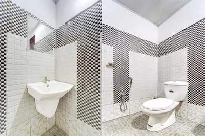 a bathroom with a toilet and a sink at Collection O Kunnamangalam Near Bus Stand in Kunnamangalam