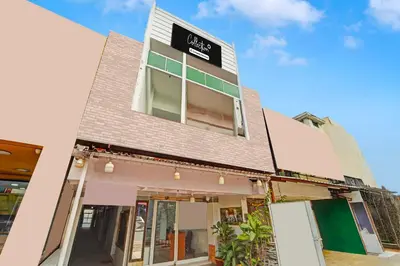 a building with a sign on the side of it at Collection O Erode VOC Park in Erode