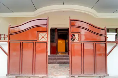 a pair of red gates in a building at Collection O IIT College Coimbatore in Coimbatore