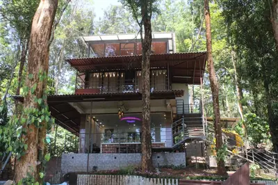 a tree house in the middle of the forest at Aambal Wayanad Pool House Resort by Veda Retreat in Wayanad