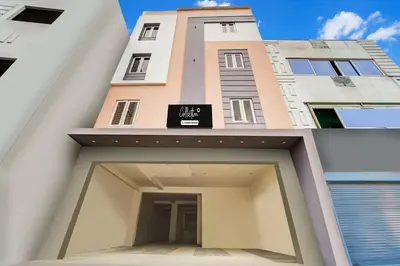 two images of a building with a sign on it at Super Collection O RS Puram North Railway Station Formerly RG Residency in Coimbatore