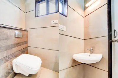 a bathroom with a toilet and a sink at Hotel O Ondipudur Bus Terminal Formerly New Paradise Inn in Irugūr